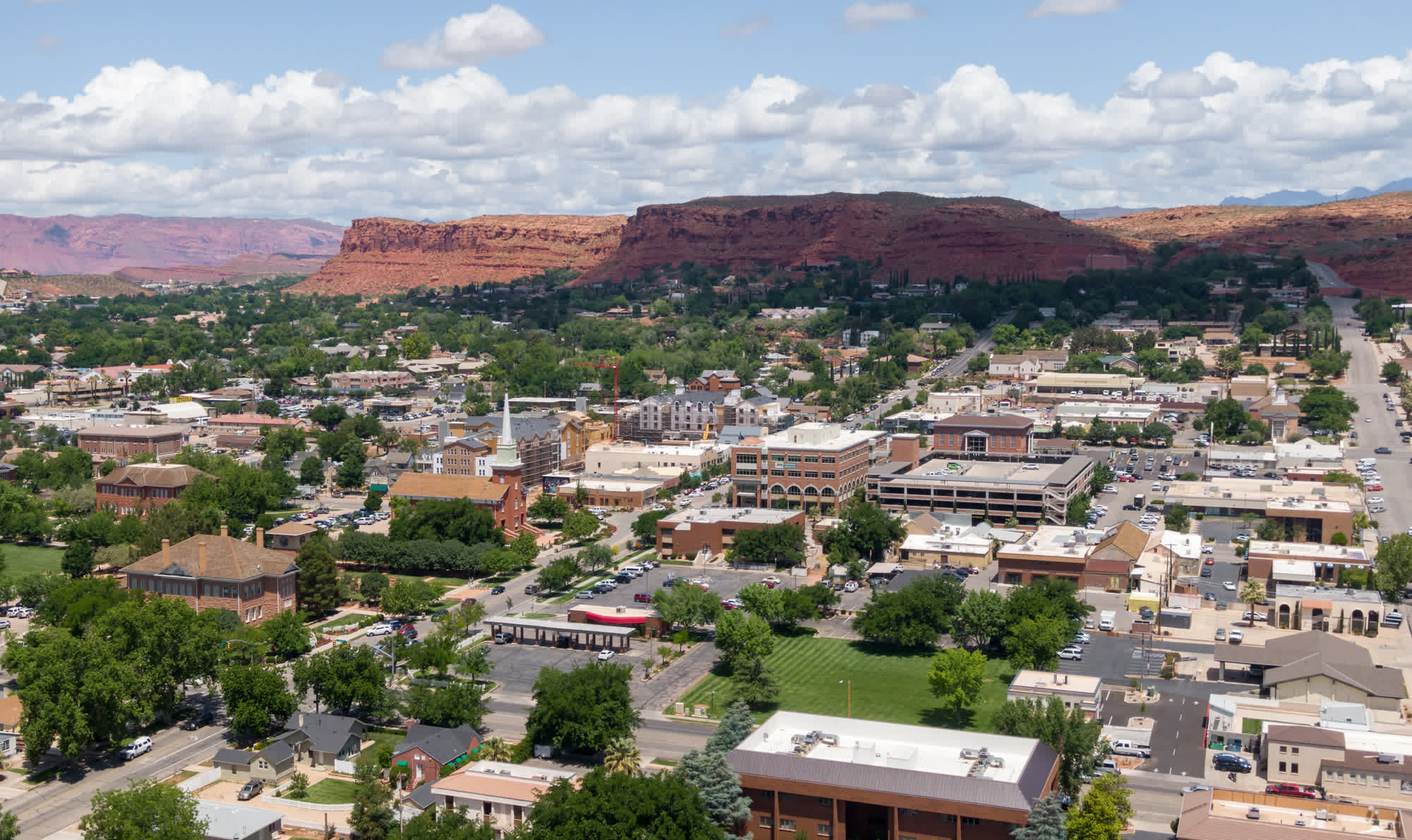 Downtown St. George, Utah, with red rock cliffs behind